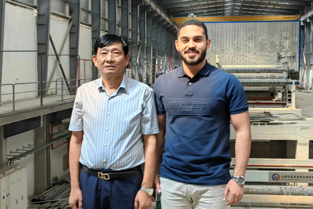 Customer inspecting factory installation of culture paper machine at FRD