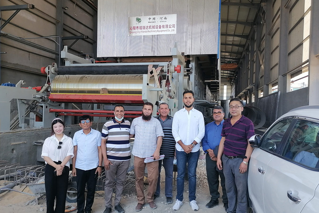 Customer inspecting installation of paper making machine at FRD