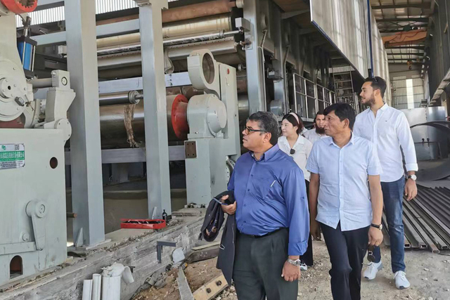 Customer reviewing installation of corrugated paper machine at FRD